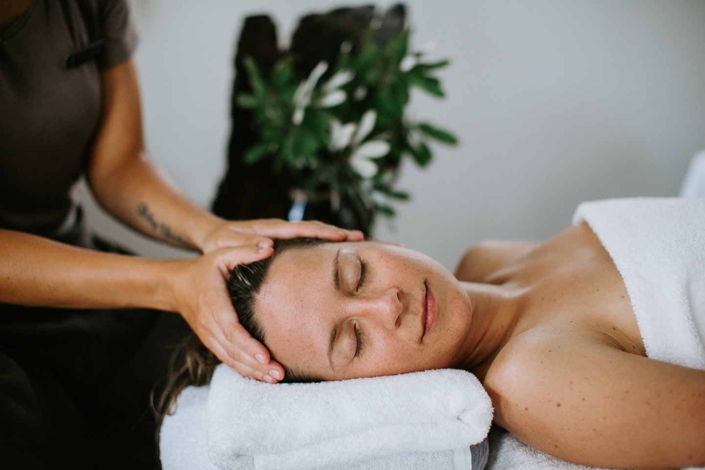 female relaxing during spa treatment