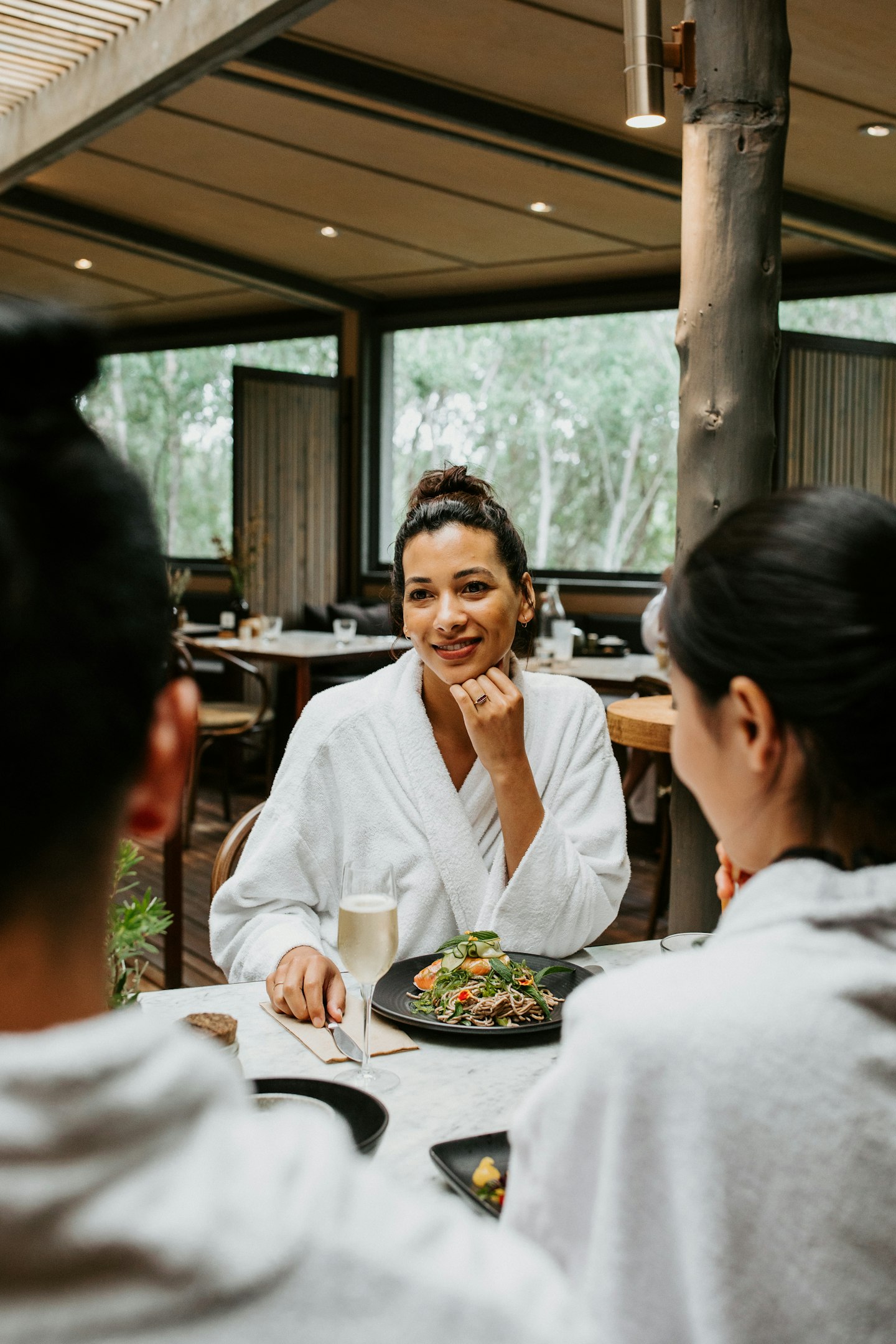 lady smiling at spa dreaming centre dining room
