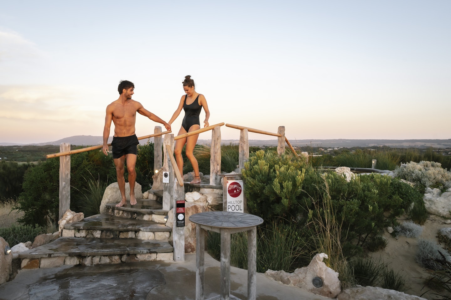 couple at hilltop pool