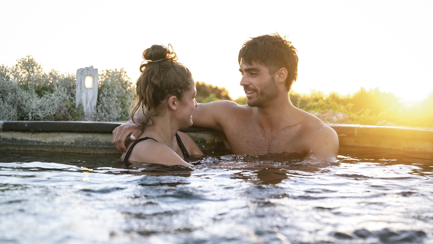 couple in hilltop pool