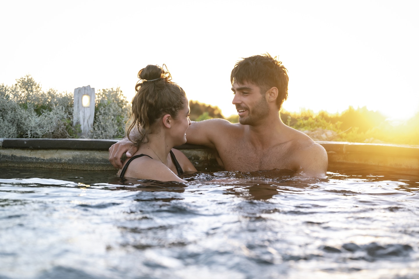 couple in hilltop pool