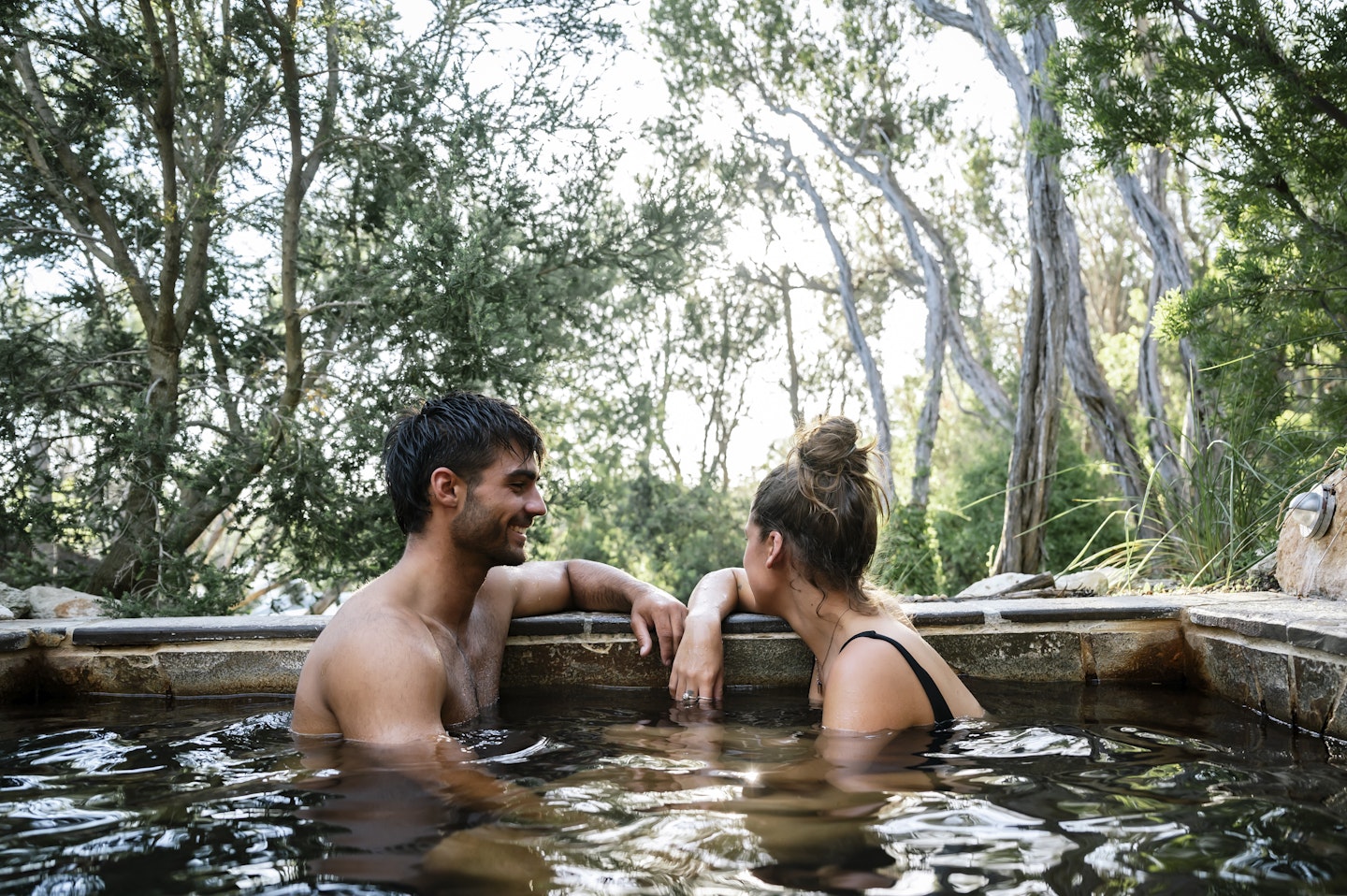 man and woman bathing in pool