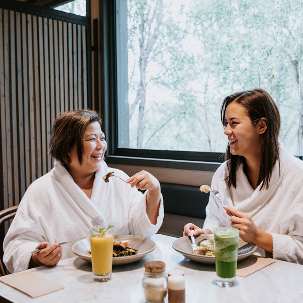 mother and daughter enjoying breakfast in the spa dreaming centre dining room
