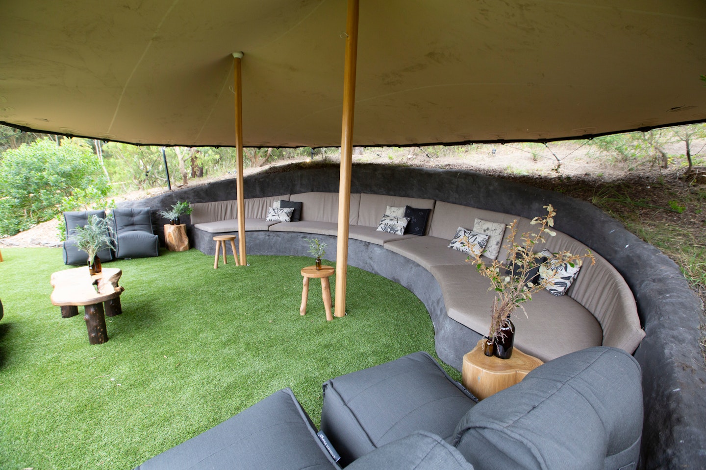 curves lounges set into rock with overhead shade 