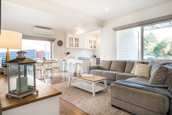 view of cosy living room, dining and kitchen of holiday home
