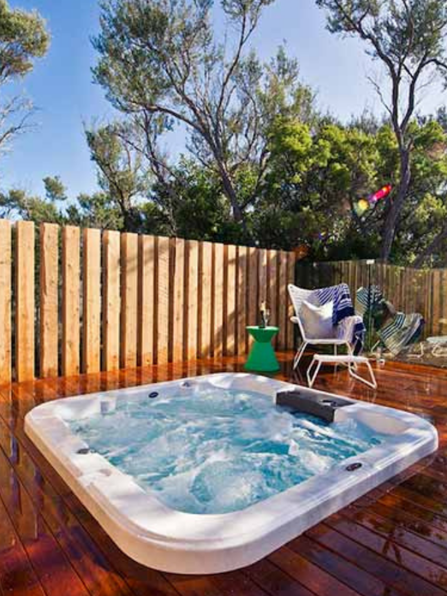 sunny timber deck with hot tub bubbling