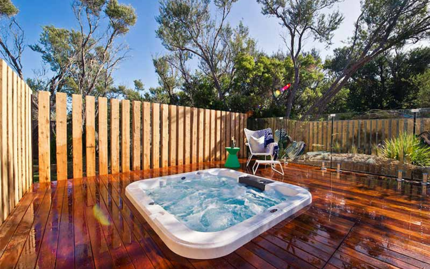 sunny timber deck with hot tub bubbling