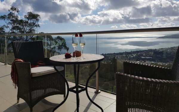 water views from balcony with champagne flutees