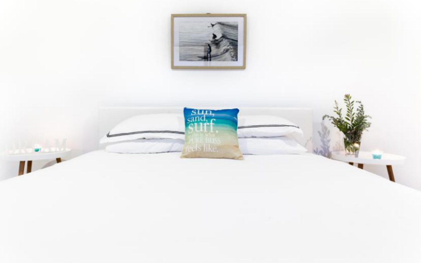 guest bedroom with white bed linen and surf coast styling