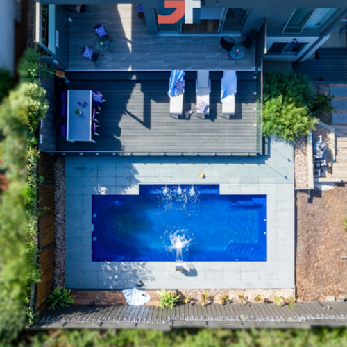 aerial view of holiday home back yard with massive inground pool