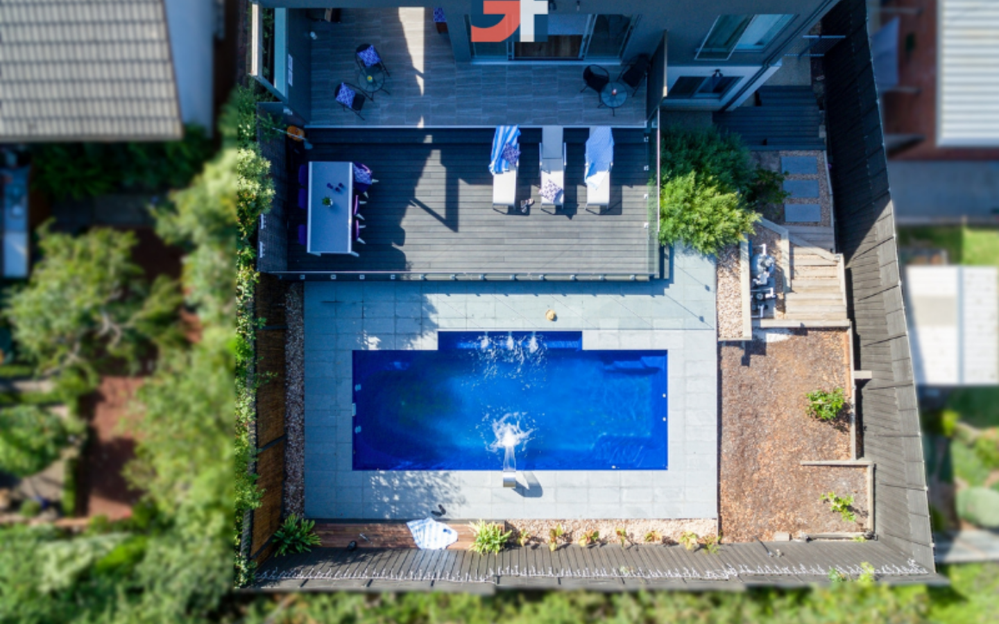 aerial view of holiday home back yard with massive inground pool