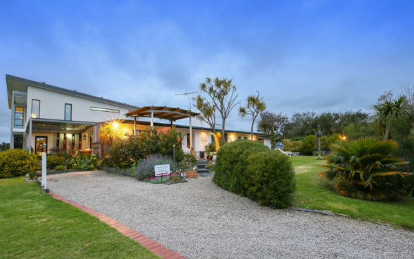 external view of holiday home with manicured gardens