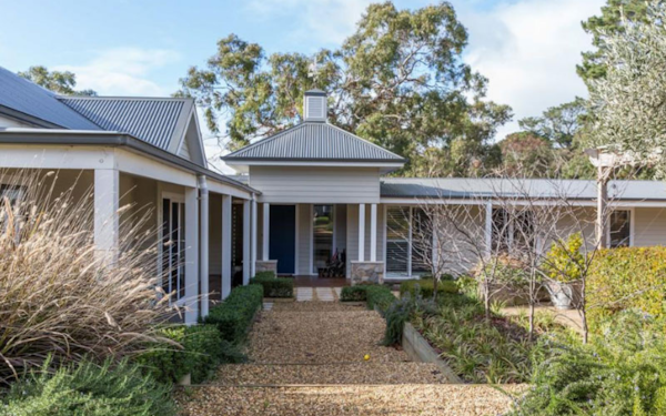 exterior of country B&B with manicured gardens