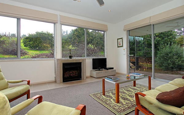 cosy living room looking out onto gardens and vineyards