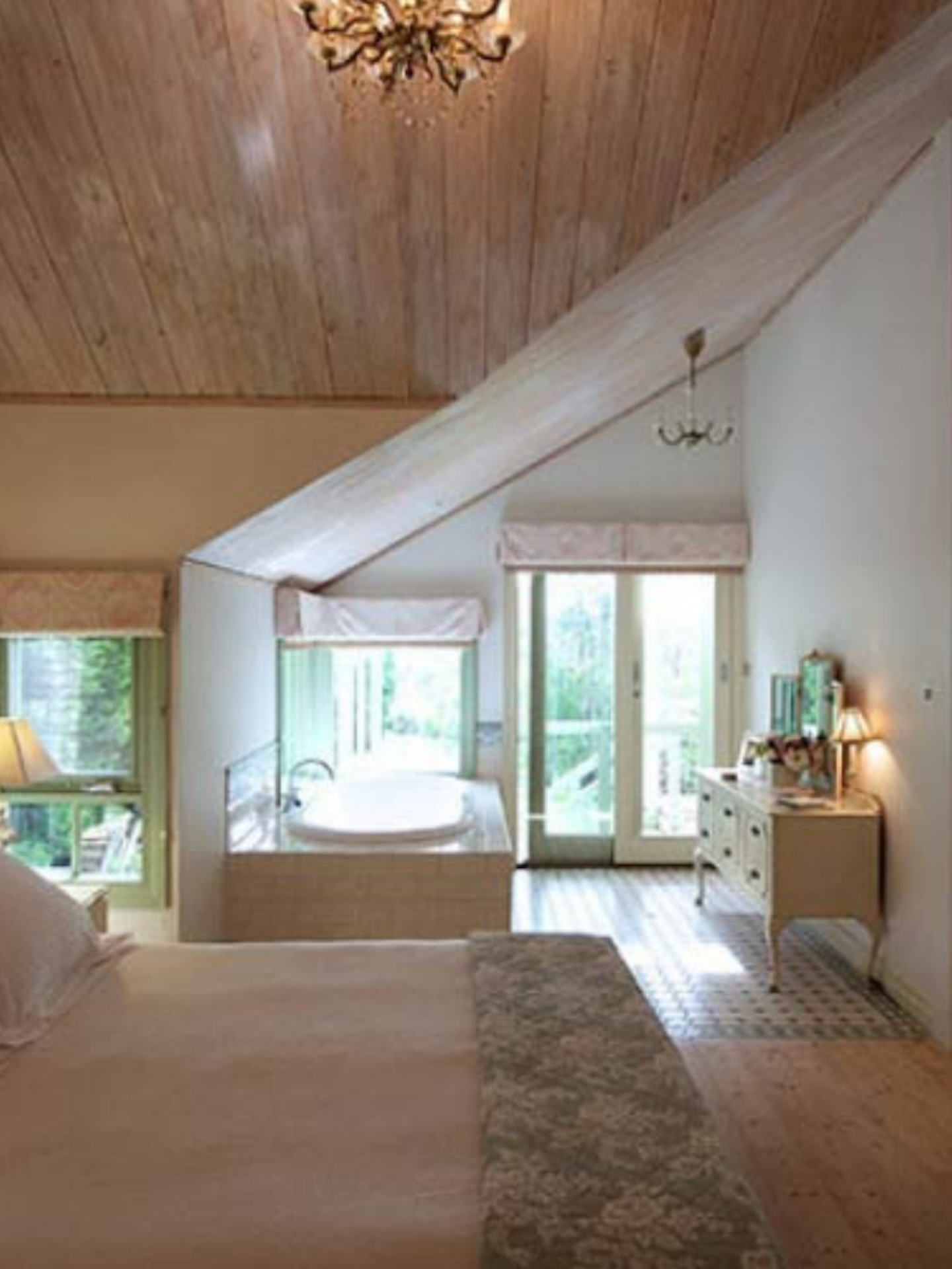 king sized bed in white and timber bedroom
