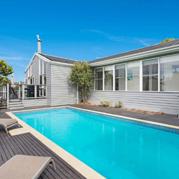 long inground pool and deck of beach house