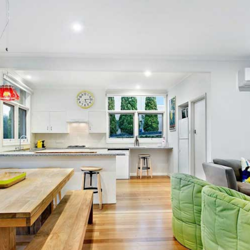 bright and sunny living, kitchen and dining areal of beach house