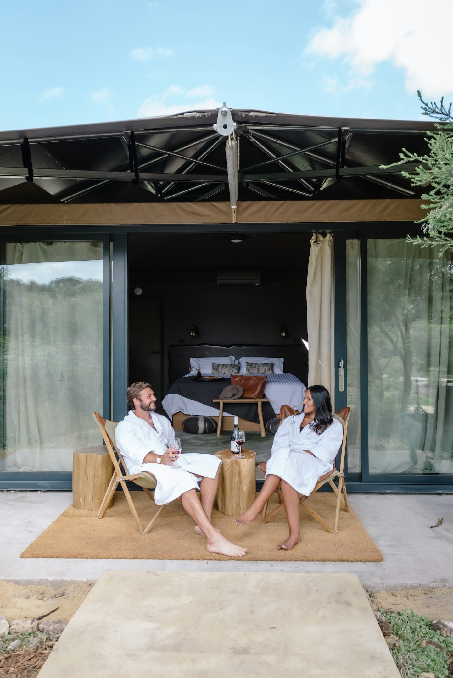 couple out the front of glamping tent