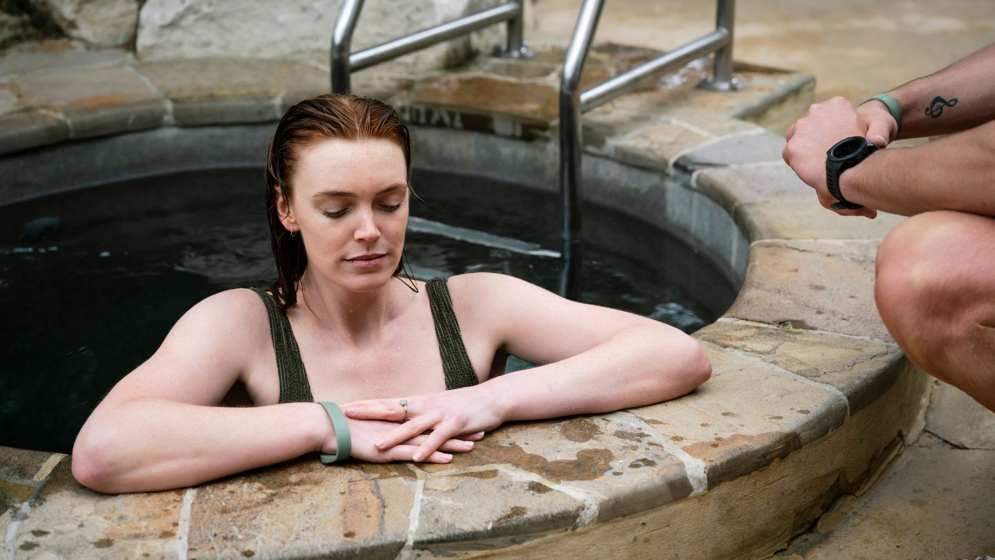 girl in ice plunge pool with eyes closed