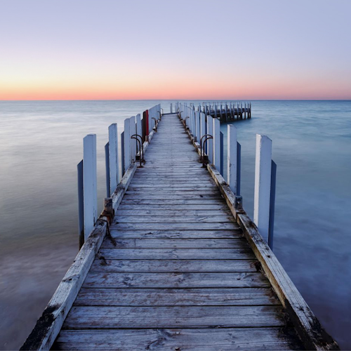 front on angle of a pier at sunset