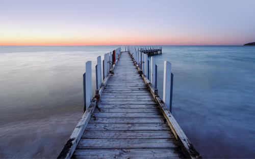 front on angle of a pier at sunset