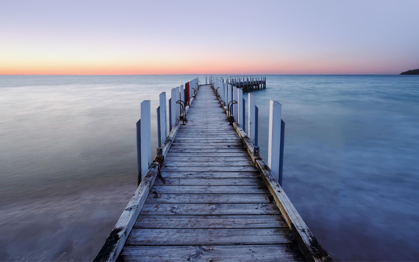 front on angle of a pier at sunset