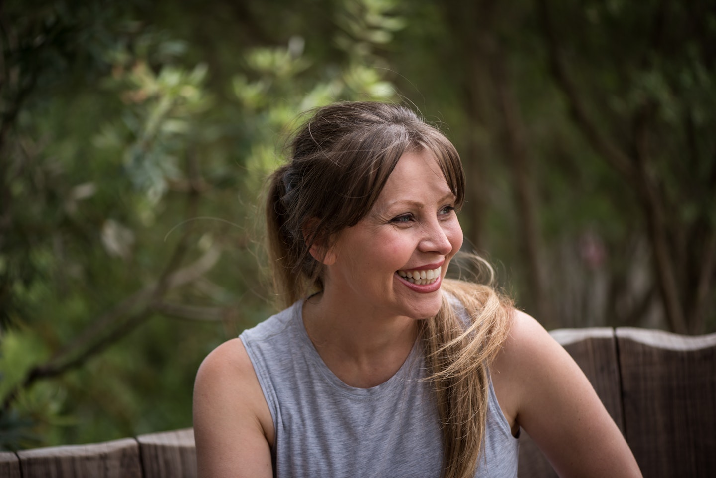 women smiling away from camera