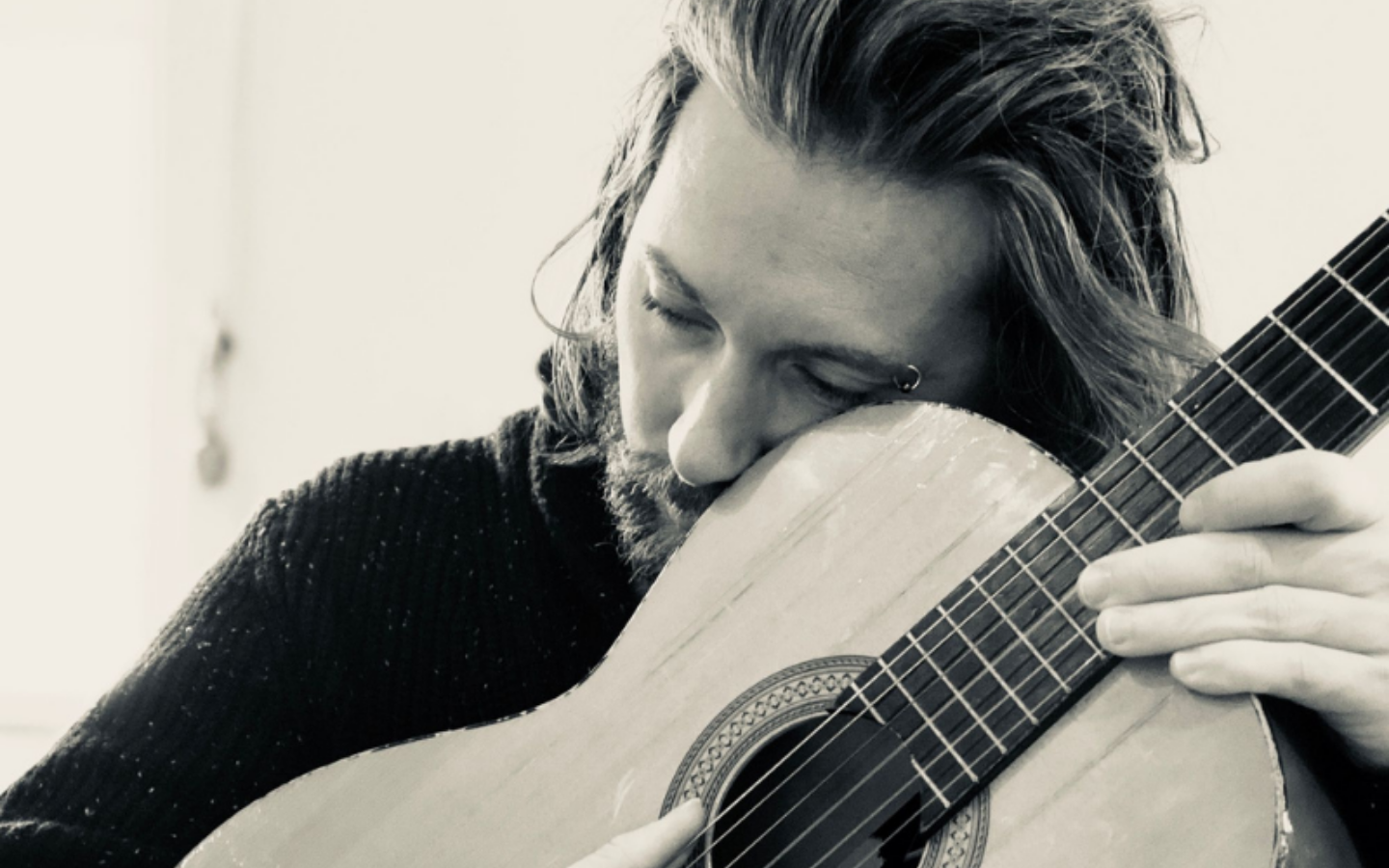 musician with a guitar in hand
