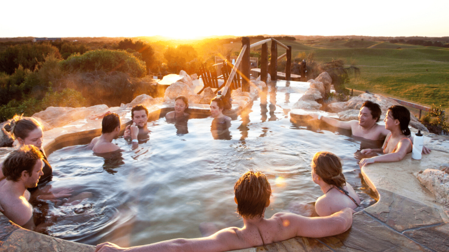 group of people relaxing in hilltop pool