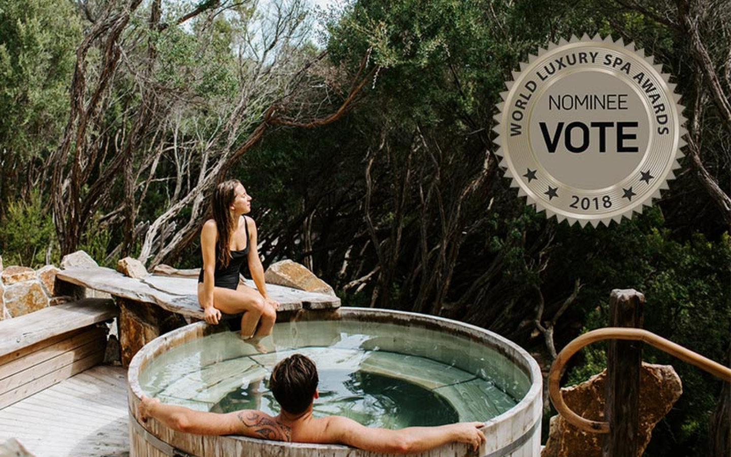 two people sitting in barrel pool