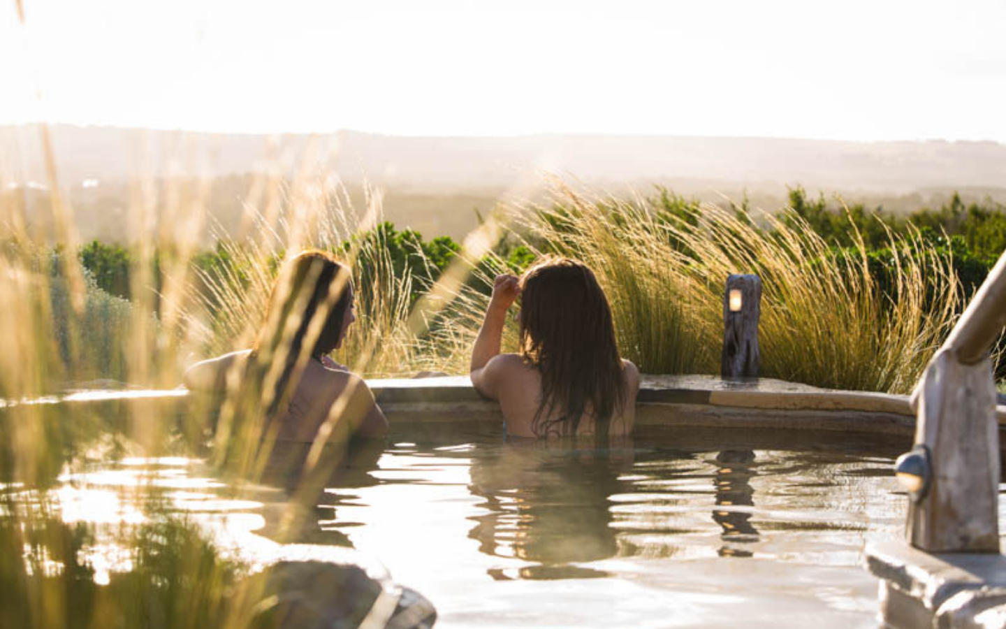 two girls in hilltop pool