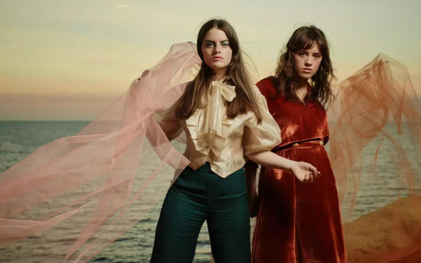 two girls in colour staring into the camera