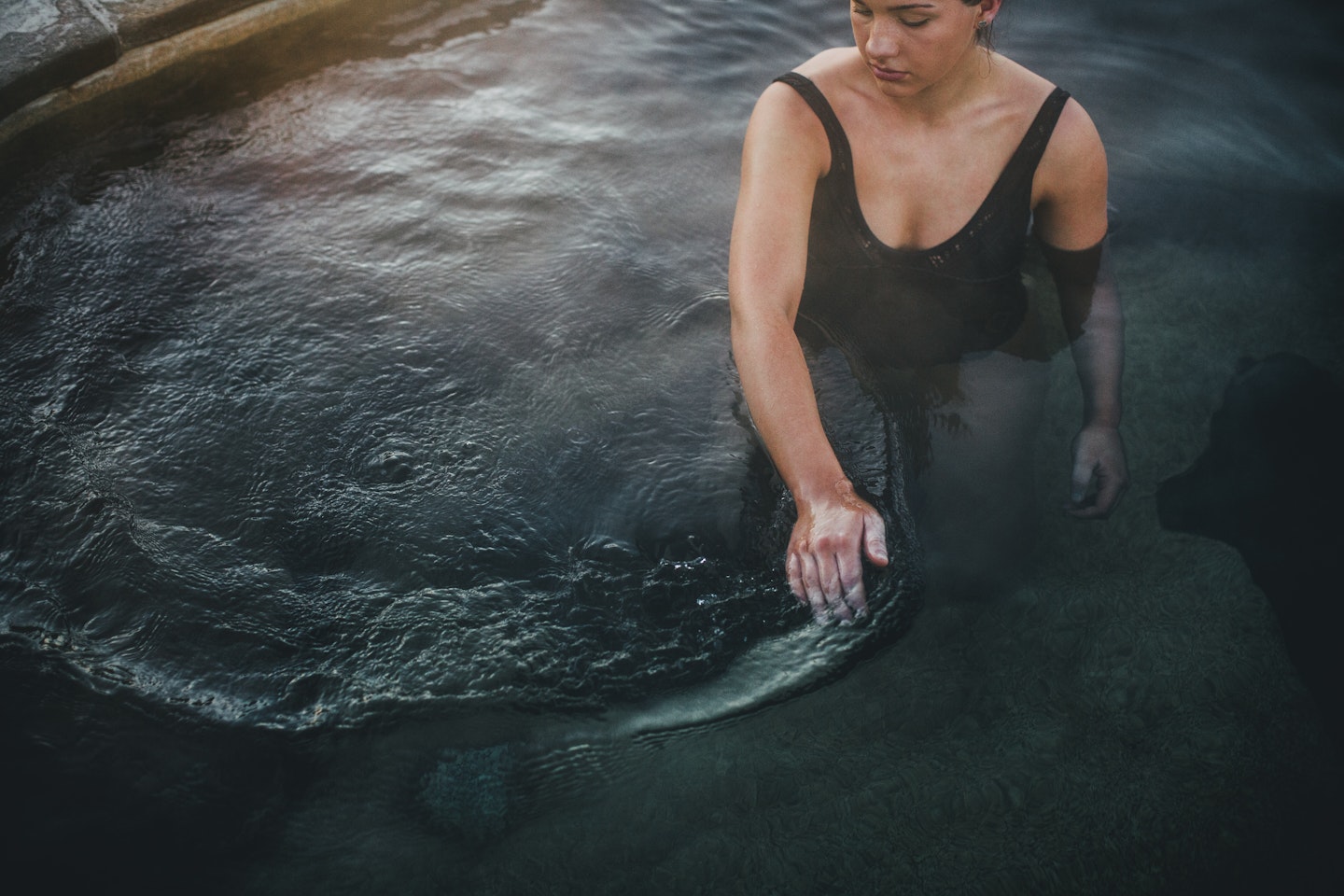 lady moving water with her hands