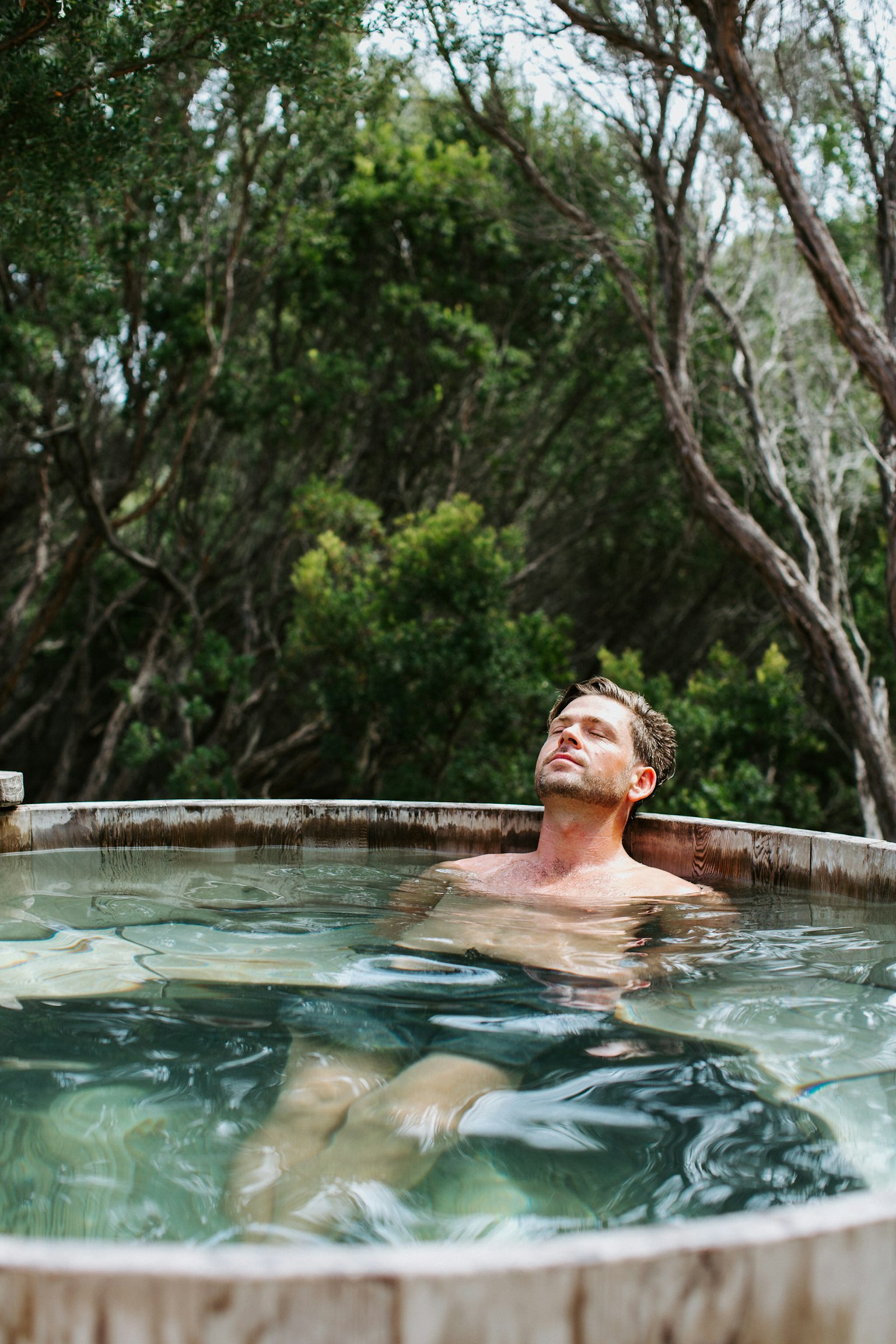 male relaxing in geothermal water
