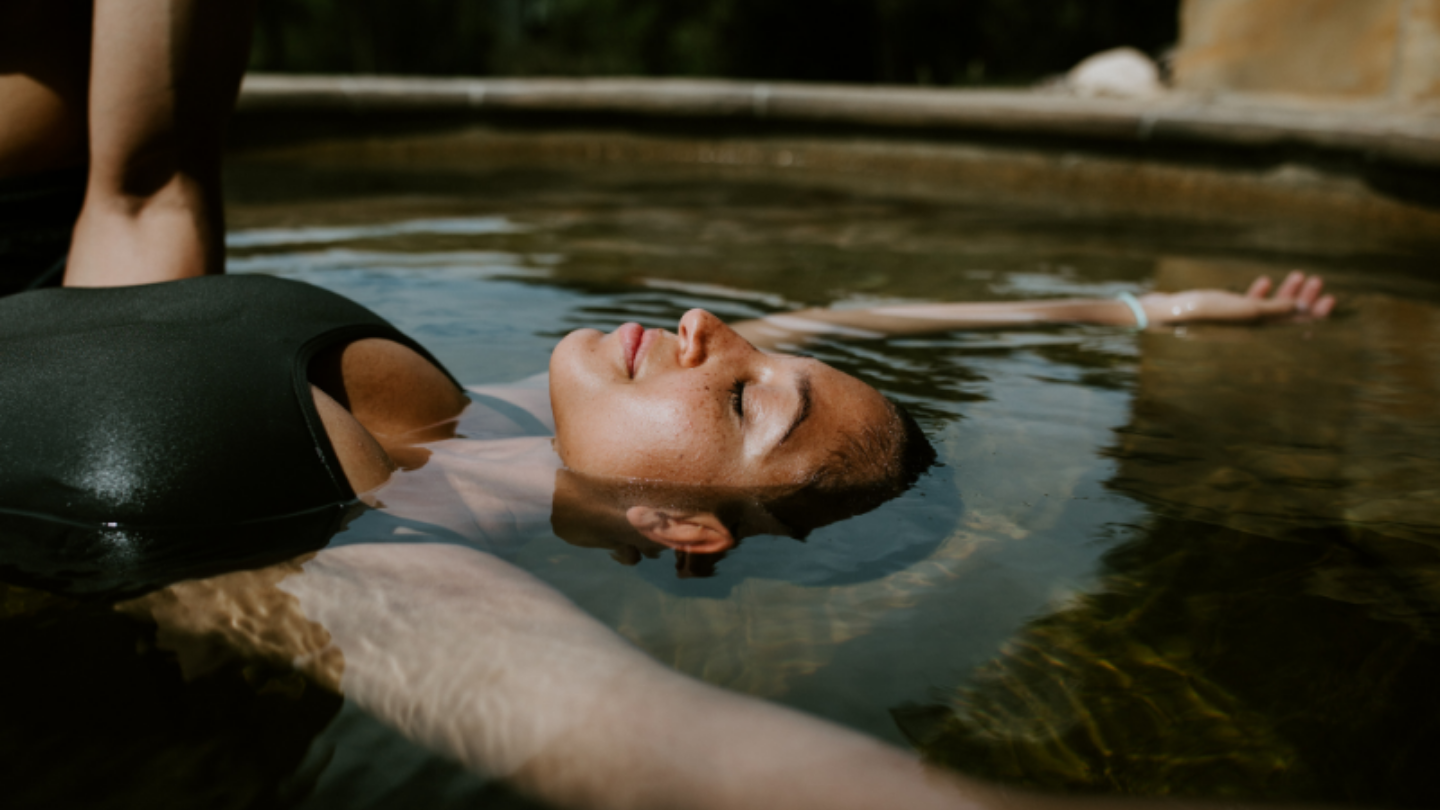 girl floating in pool