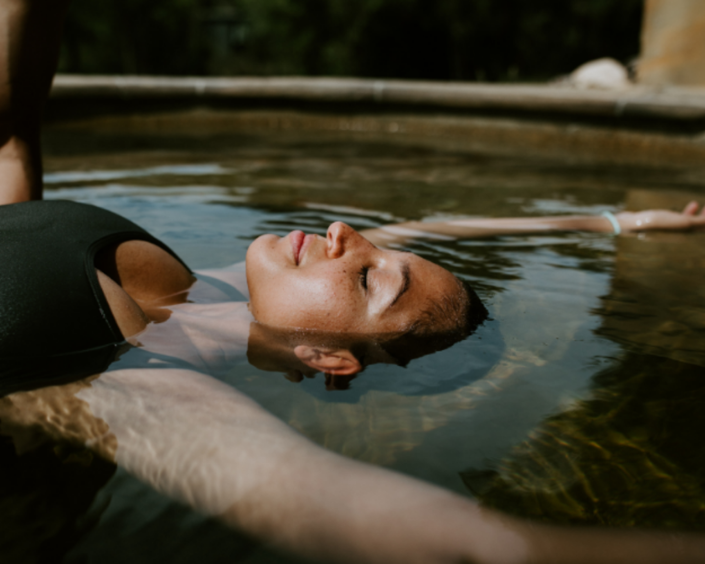 girl floating in pool