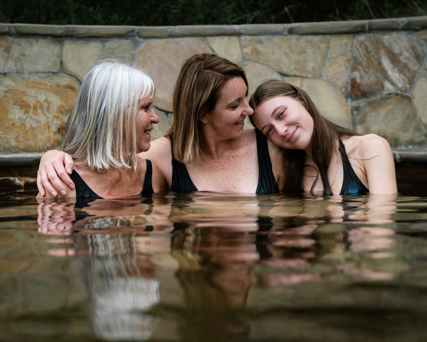 mother and daughters bathing