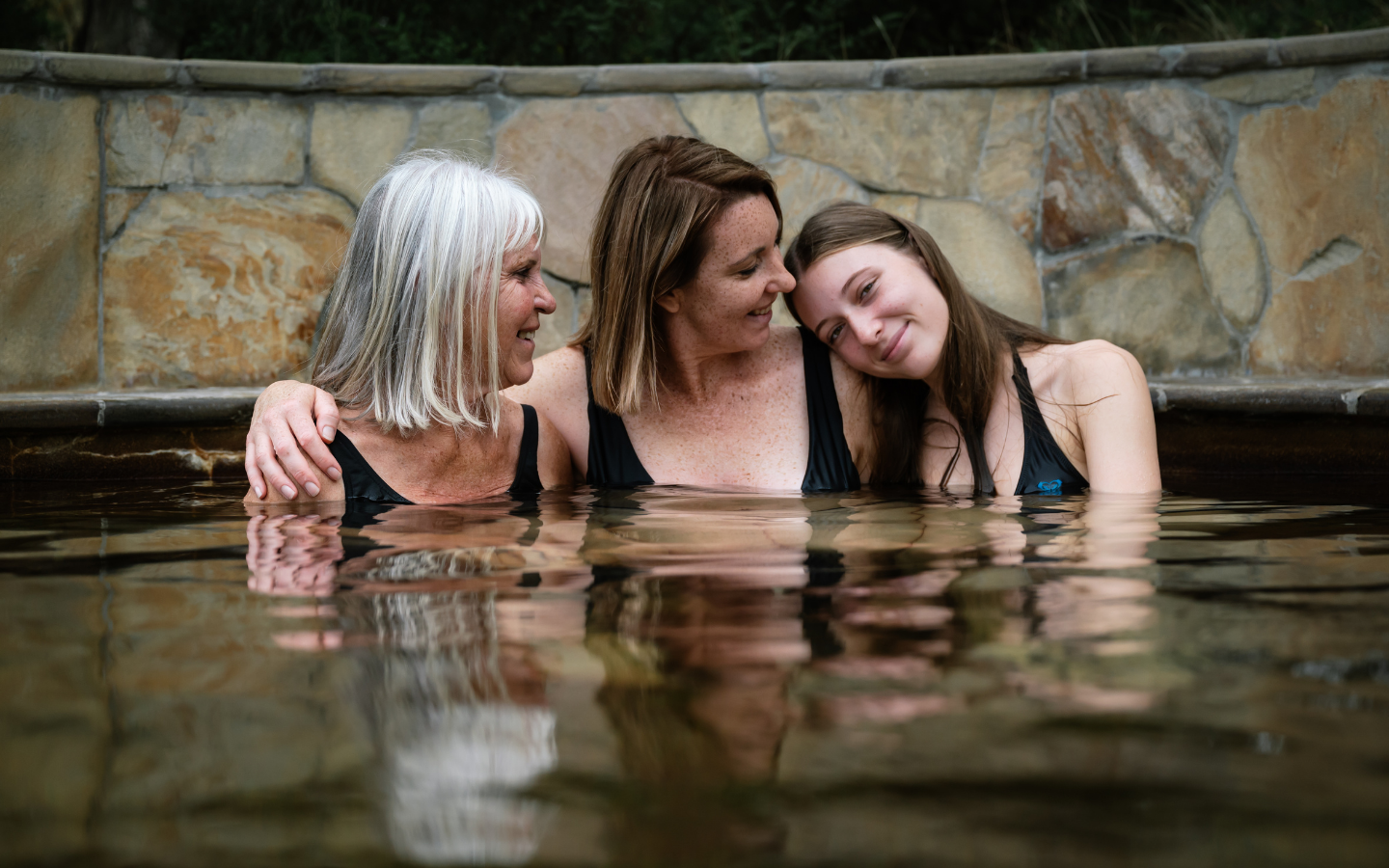 mother and daughters bathing