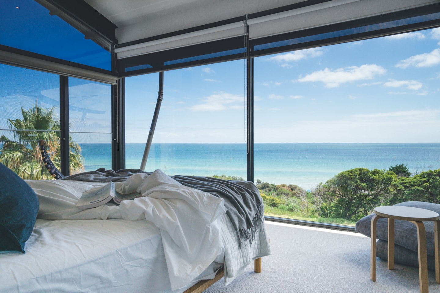 a bed looking out to the ocean