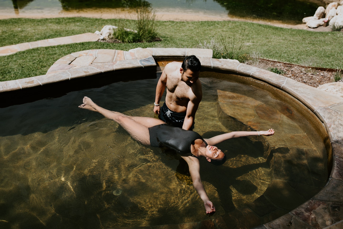 girl floating in a pool