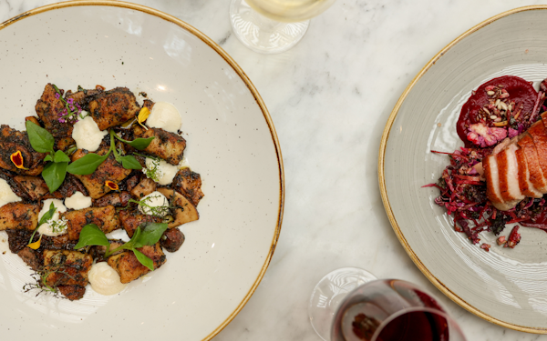 a plate of gnocchi and duck