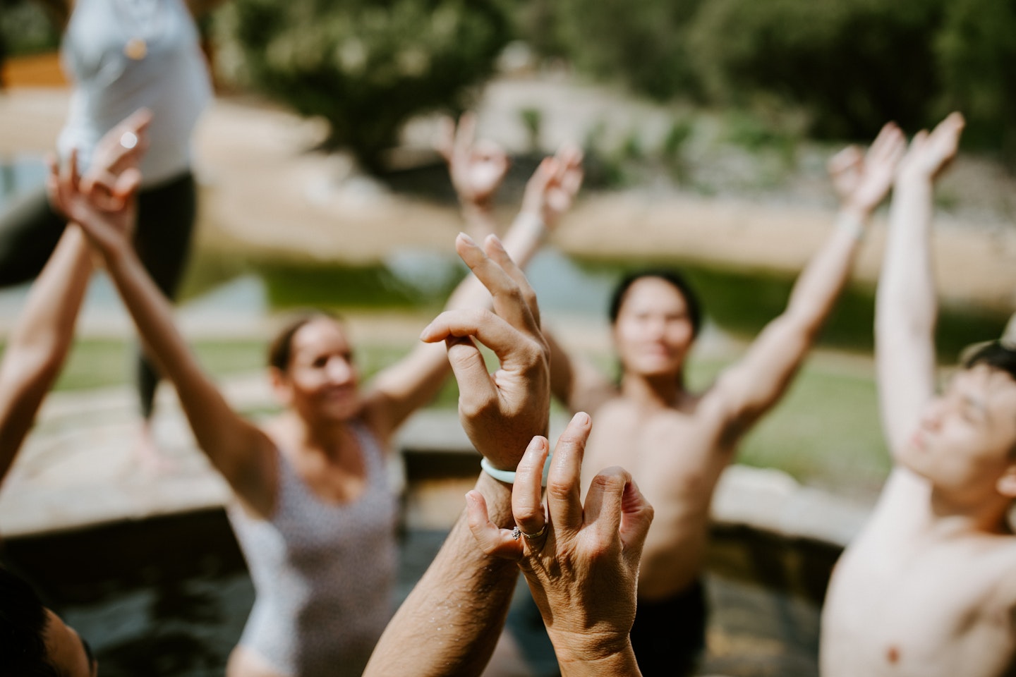 a group of people doing a yoga pose