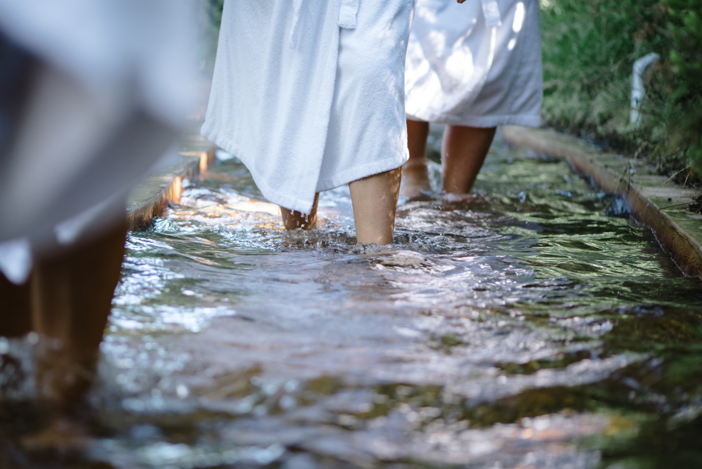 feet walking through the water