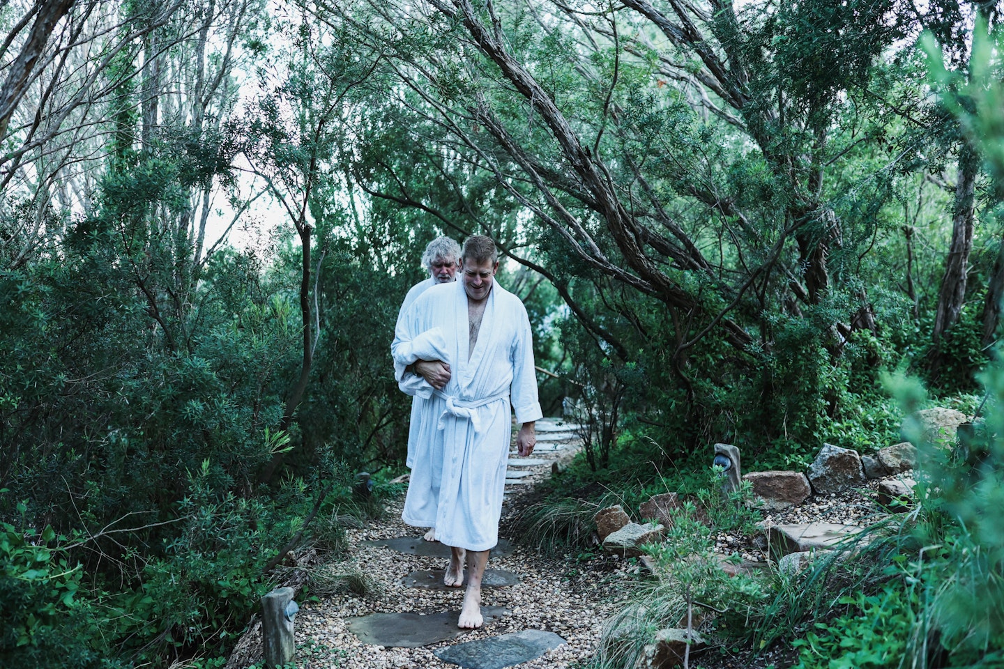 men walking through the bath house