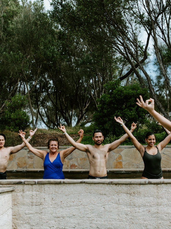 people doing yoga in the baths