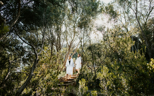 Two women walking down the stairs in the bathing gully