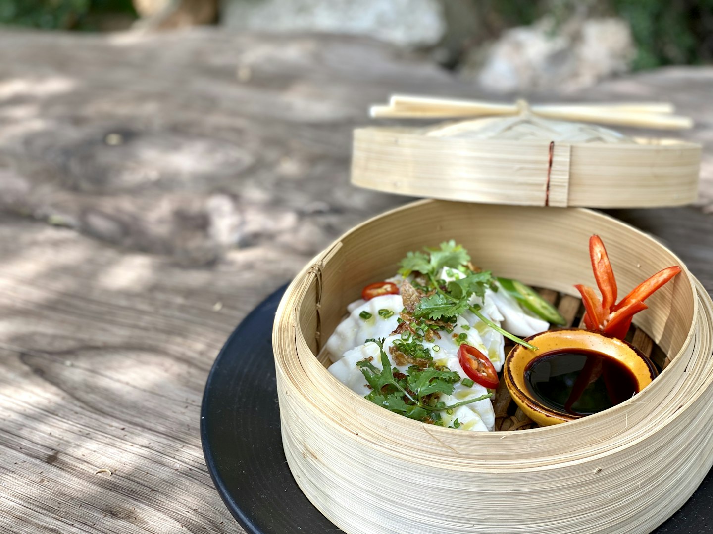 a stem basket of dumplings