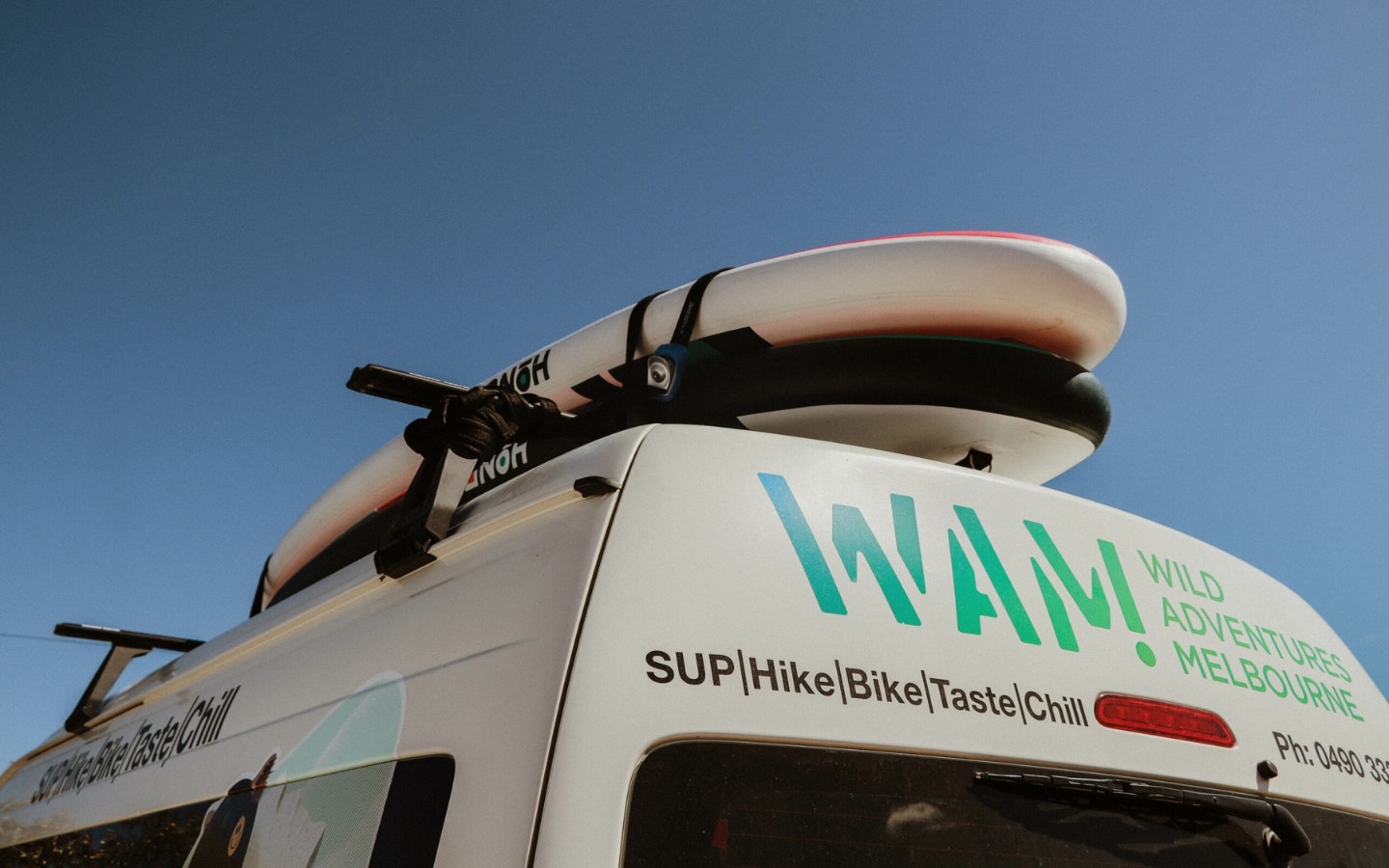 a van with a SUP on top