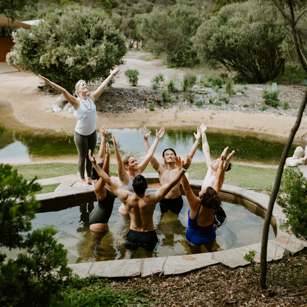 a group of people doing yoga