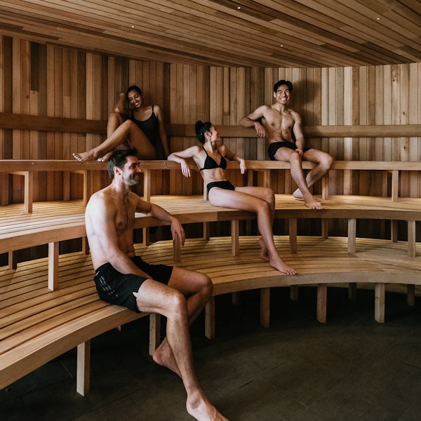 four people in a sauna